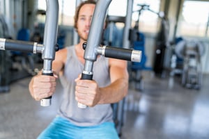 bigstock-Gym-machine-closeup-on-male-ha-152032289