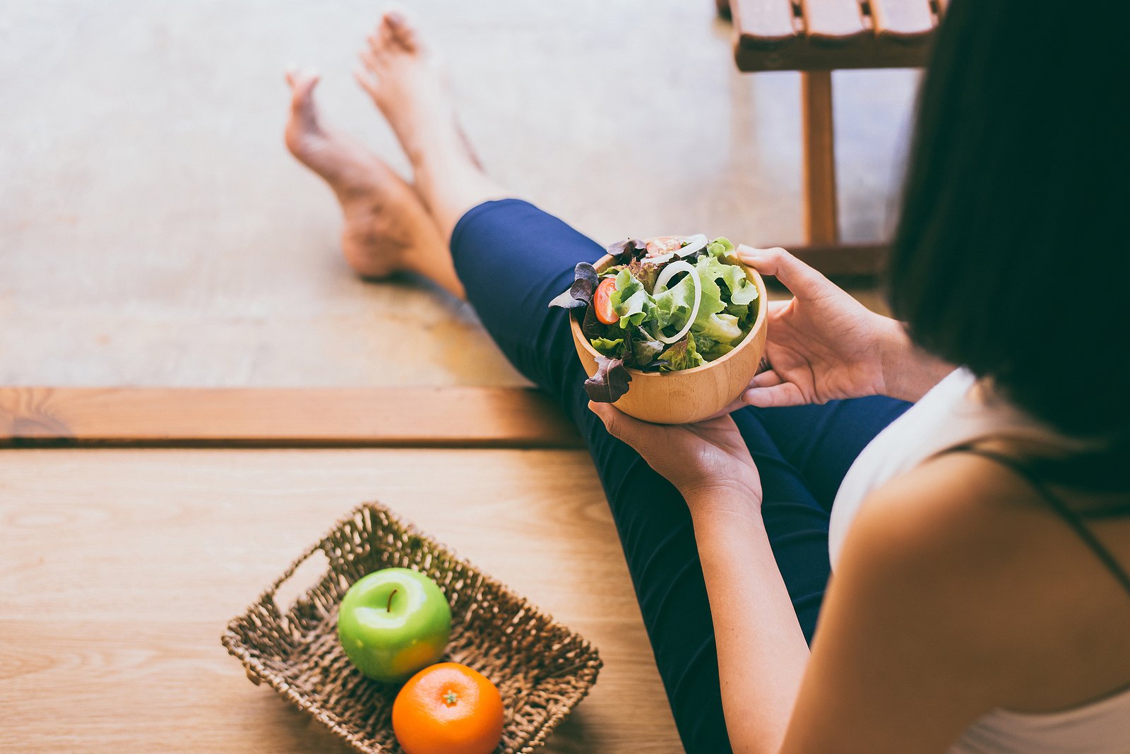 bigstock-Woman-Hands-Holding-And-Eating-336258346